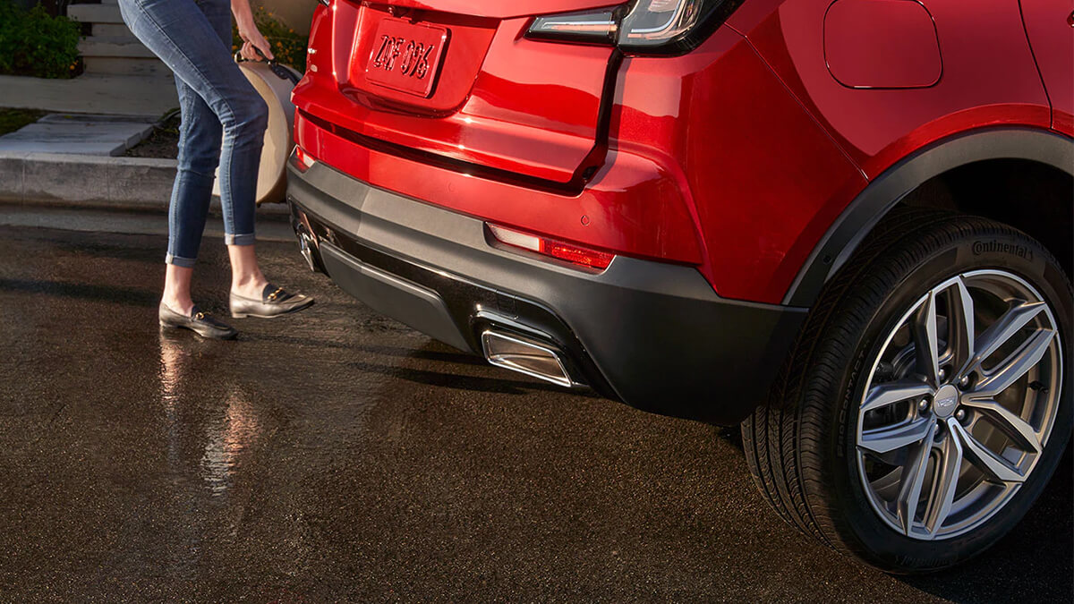 Red XT4 parked outside a house.