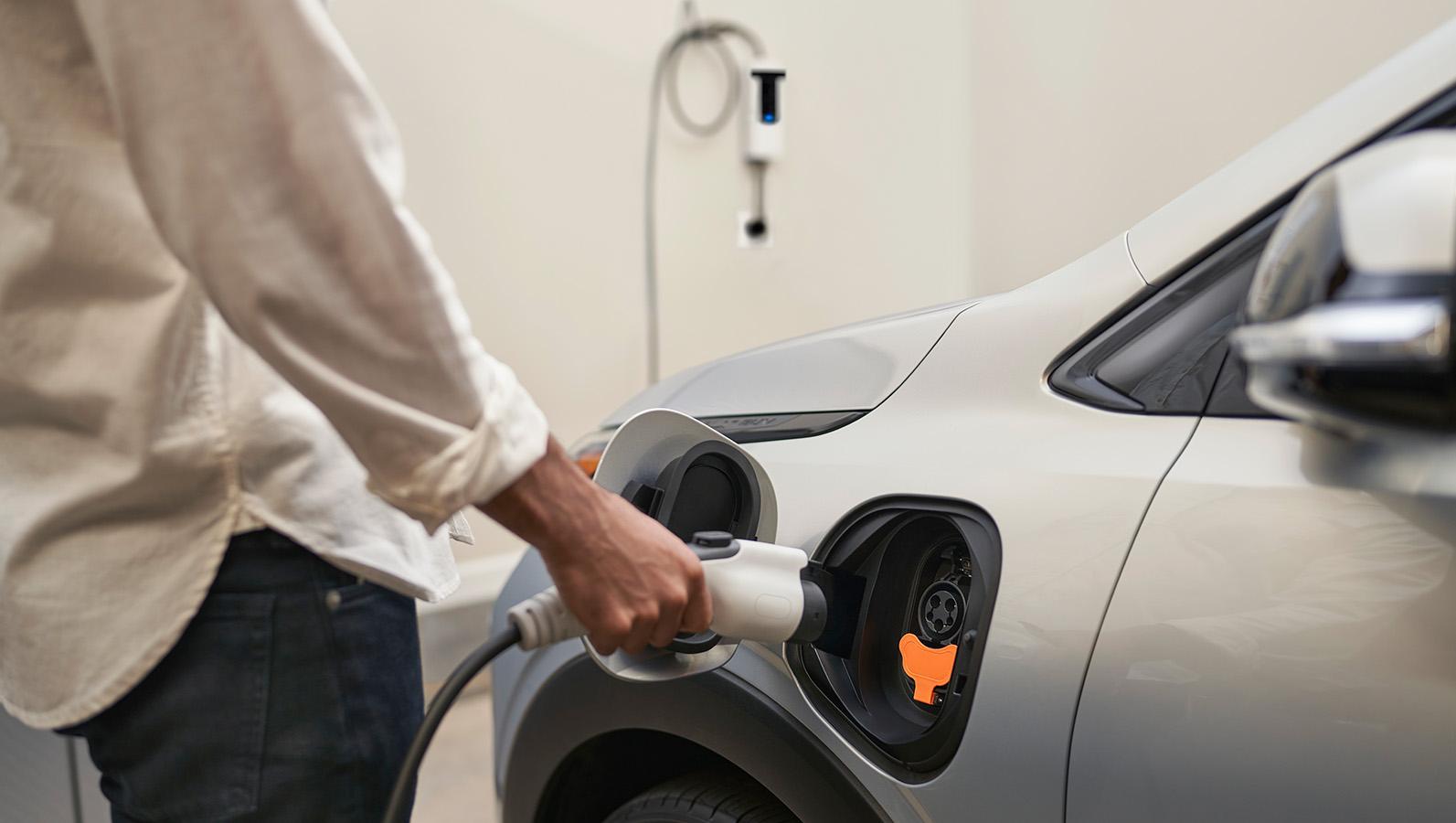 Person charging 2023 Chevrolet Bolt EUV Person charging 2023 Chevrolet Bolt EUV