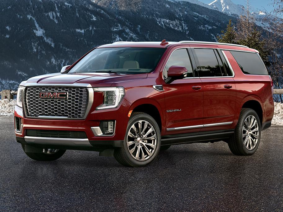 A 2021 GMC Yukon XL near a snow mountain