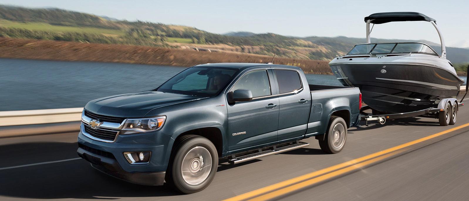 Chevrolet Colorado on a road near lake Chevrolet Colorado on a road near lake