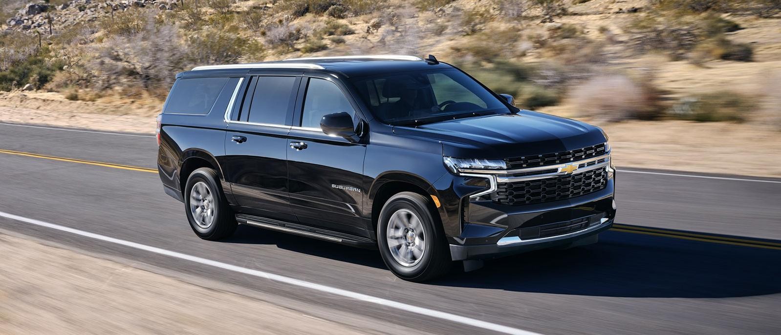 Chevrolet Suburban cruising on the road.