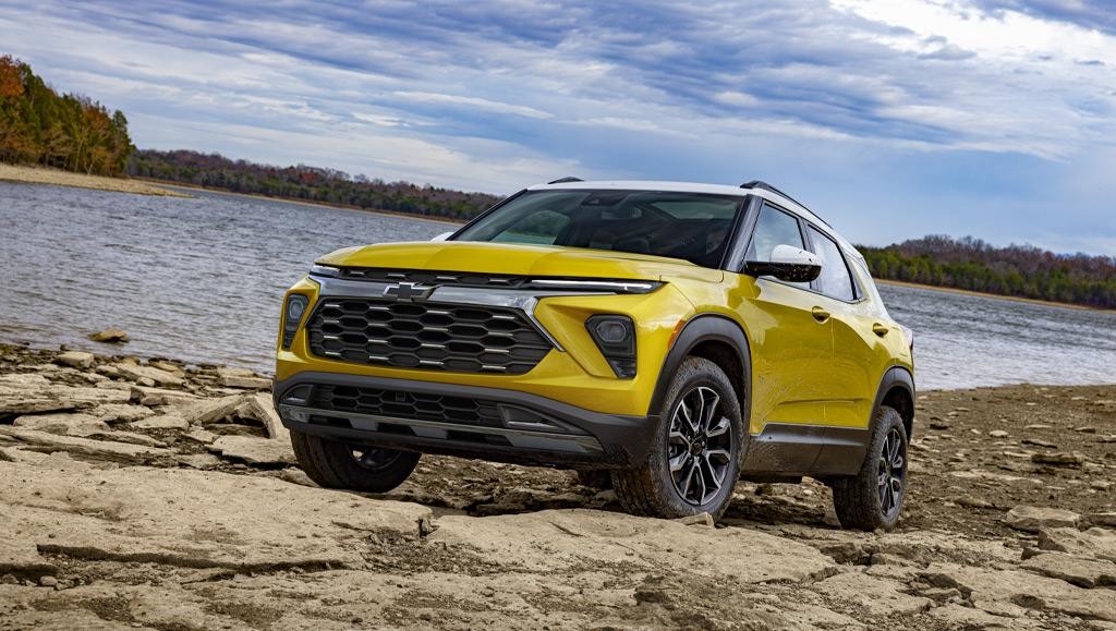 Yellow 2025 Trailblazer on a rocky beach