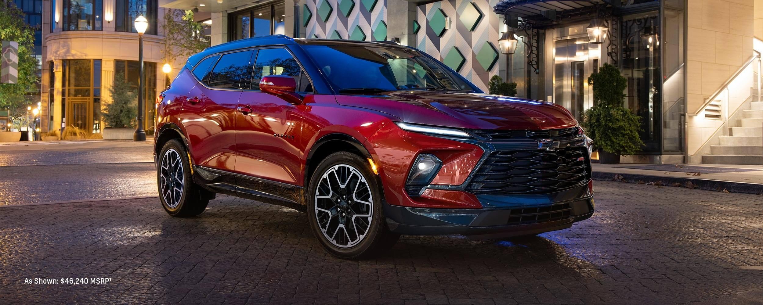 2023 Chevrolet Blazer parked in front of house.