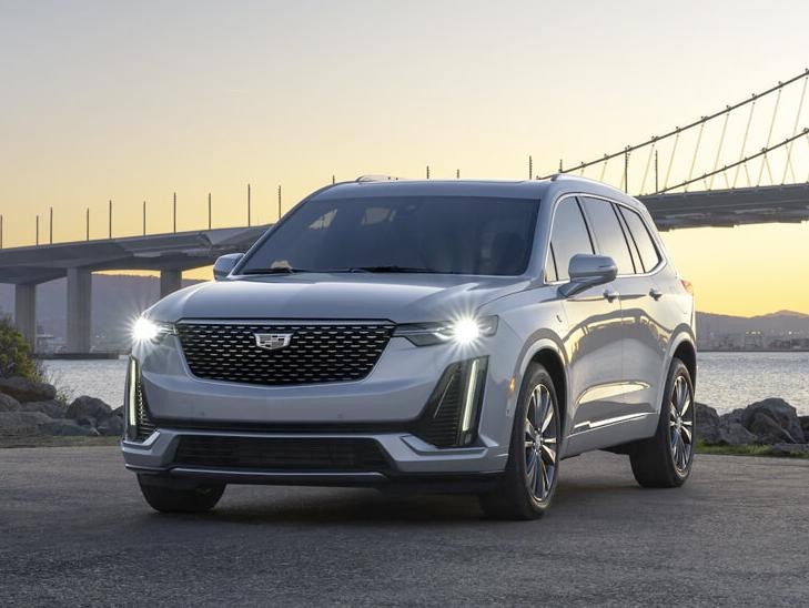 Exterior Shot of 2021 XT6 with Bridge and sunset in background
