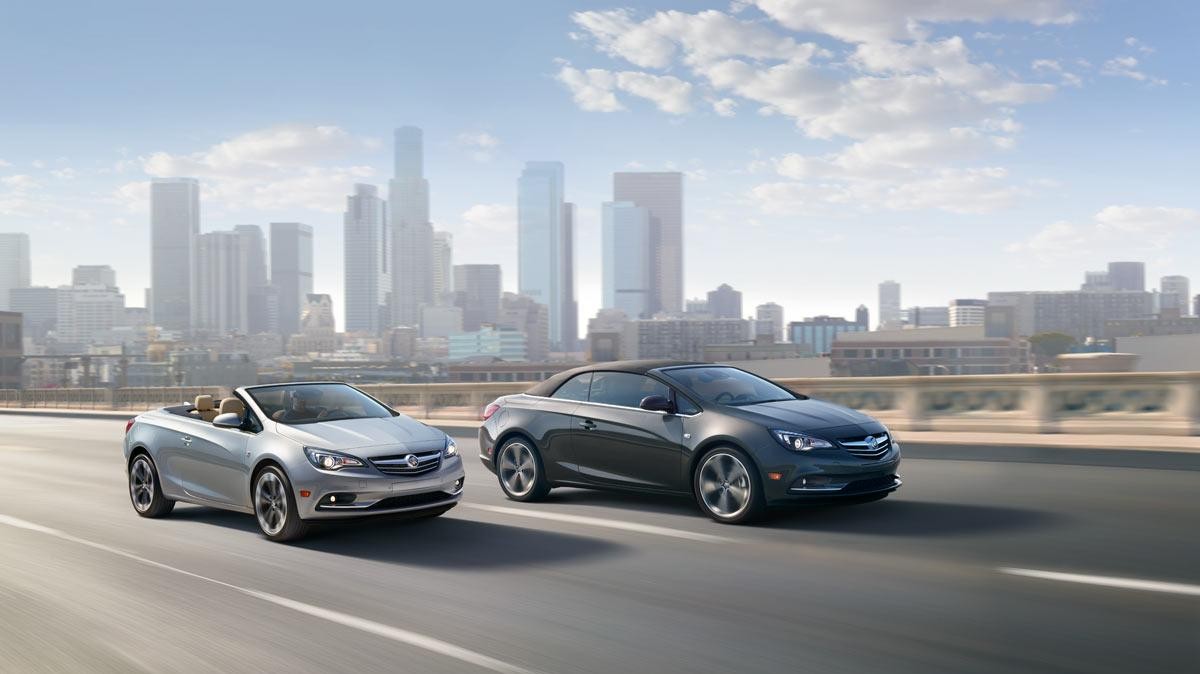 Two Buick Cascadas driving down the highway