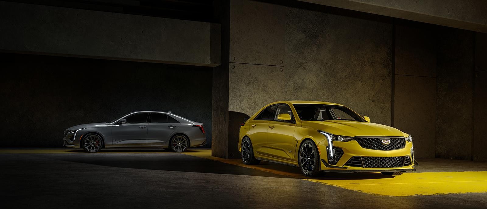 Cadillac CT4-V in Argent Silver Metallic and Cadillac CT4-V Blackwing in Cyber Yellow Metallic.