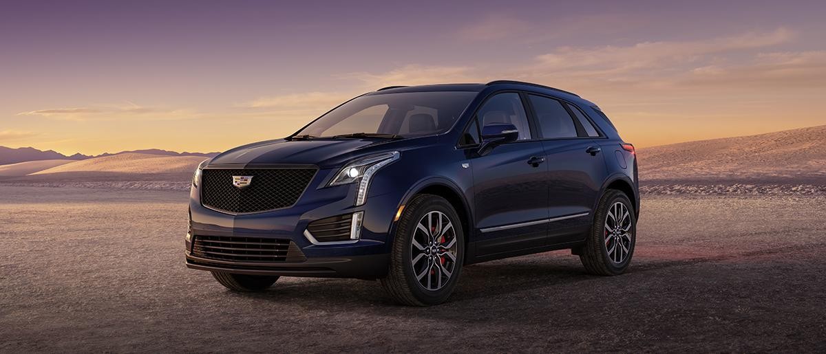 A white 2023 Cadillac XT5 in open area