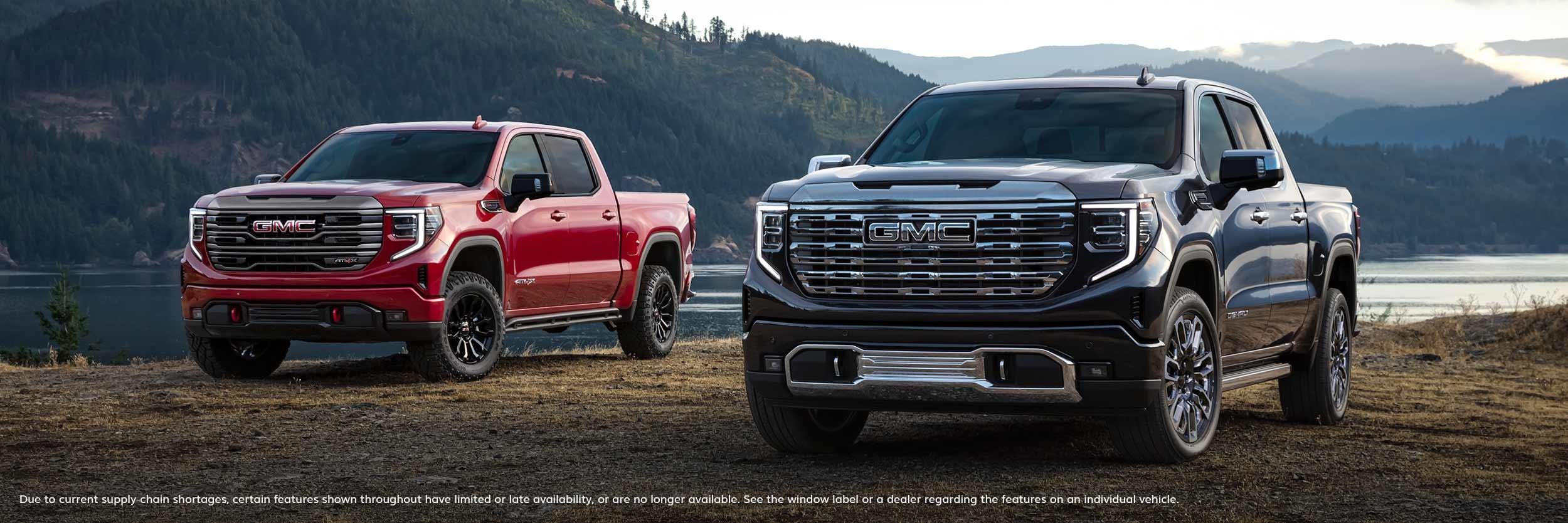 GMC Sierra 1500 parked near a river.