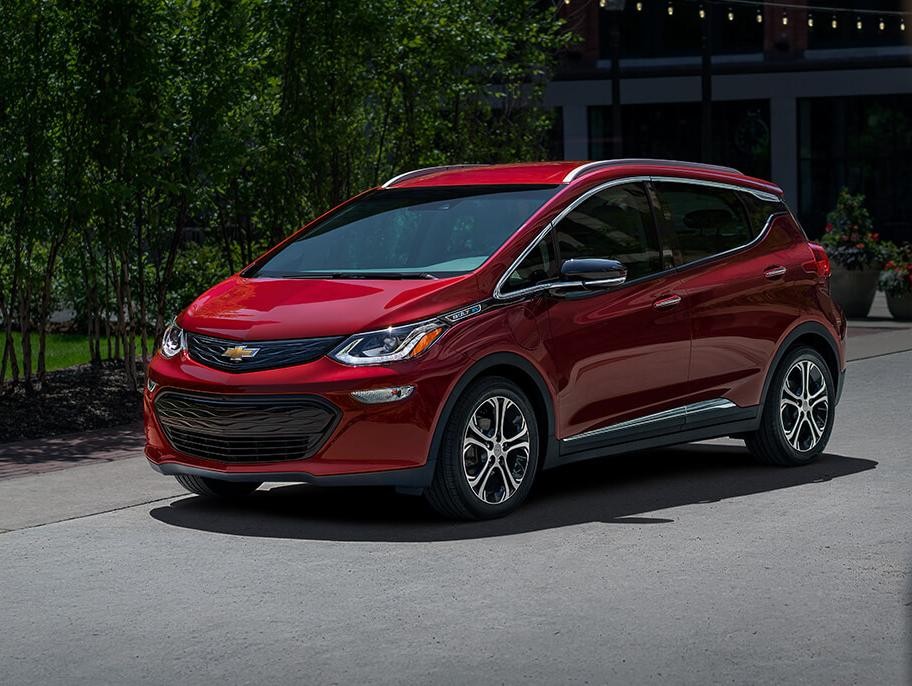 2021 Chevy Bolt Ev parked in front of a house.