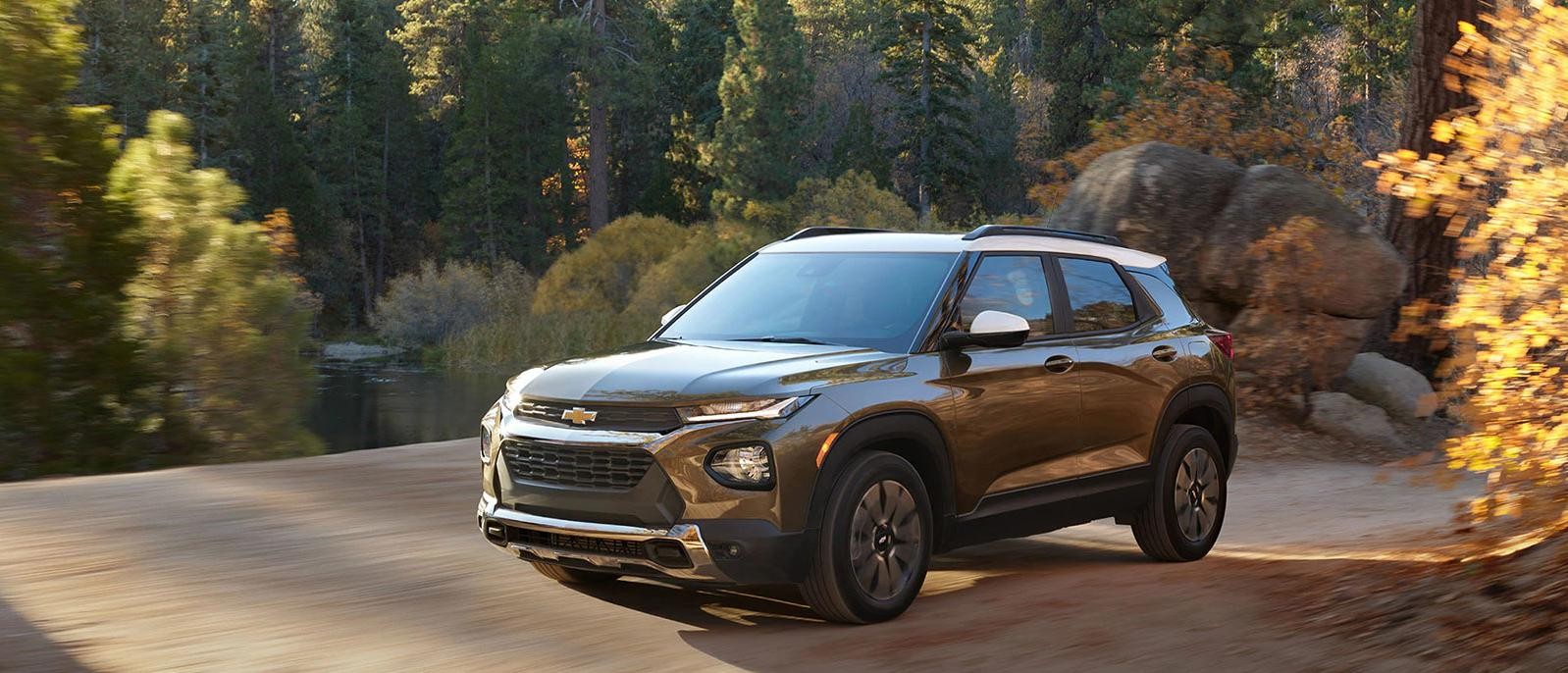 Chevy Trailblazer on a road near woods