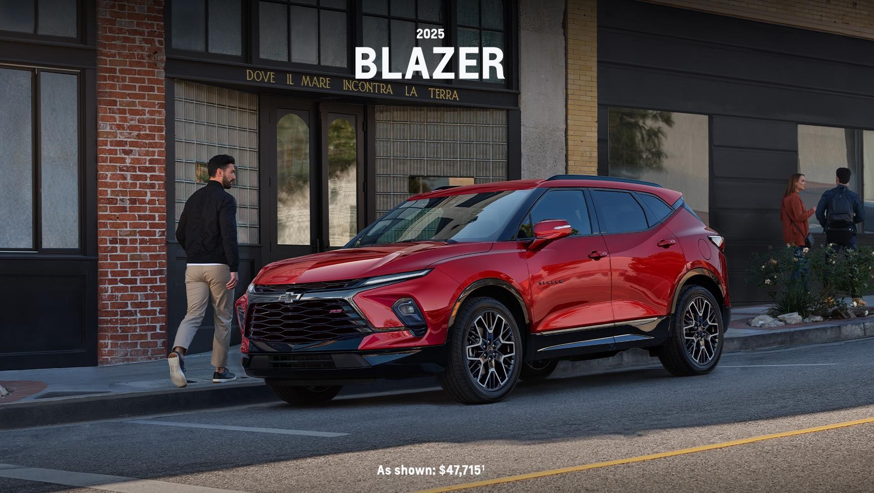 Red 2025 Blazer parked by a sidewalk in a city Red 2025 Blazer parked by a sidewalk in a city