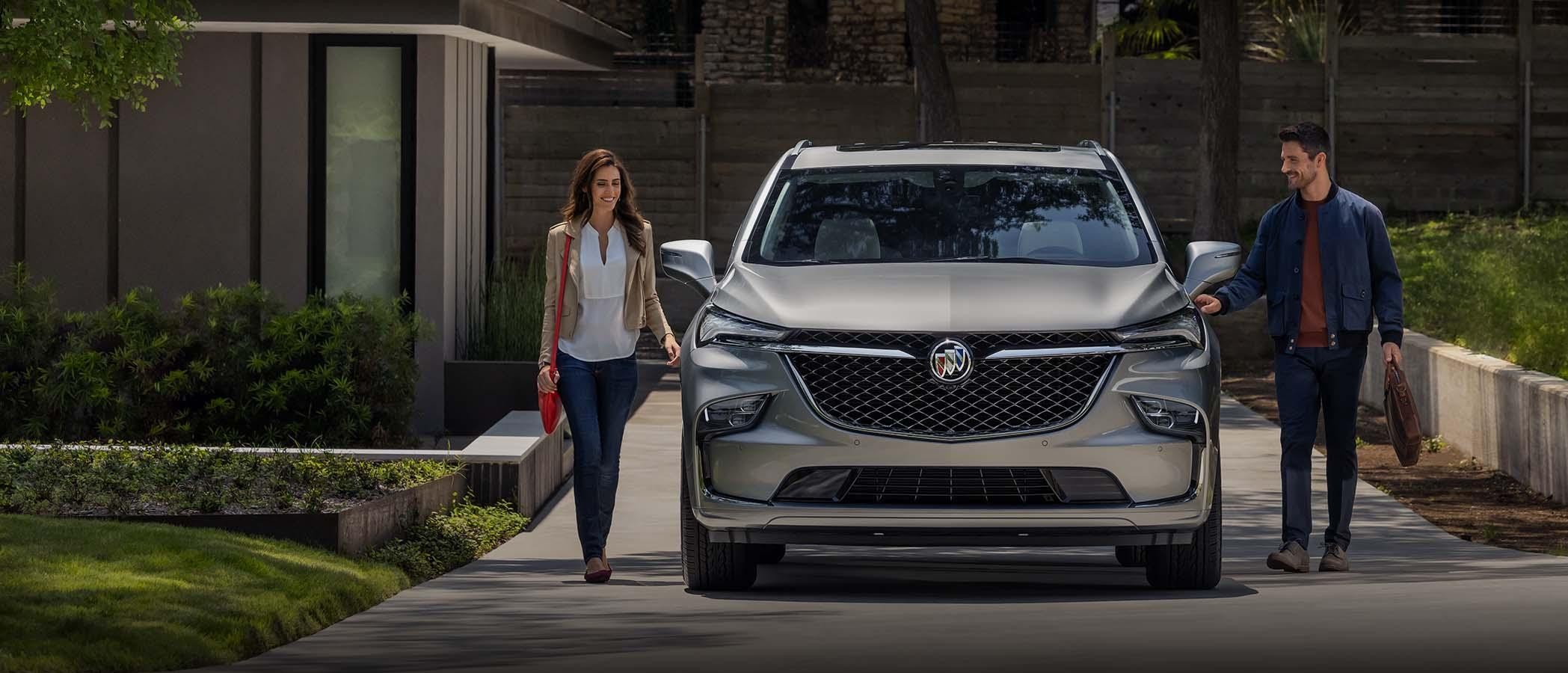 2024 Enclave parked in driveway in front of house.