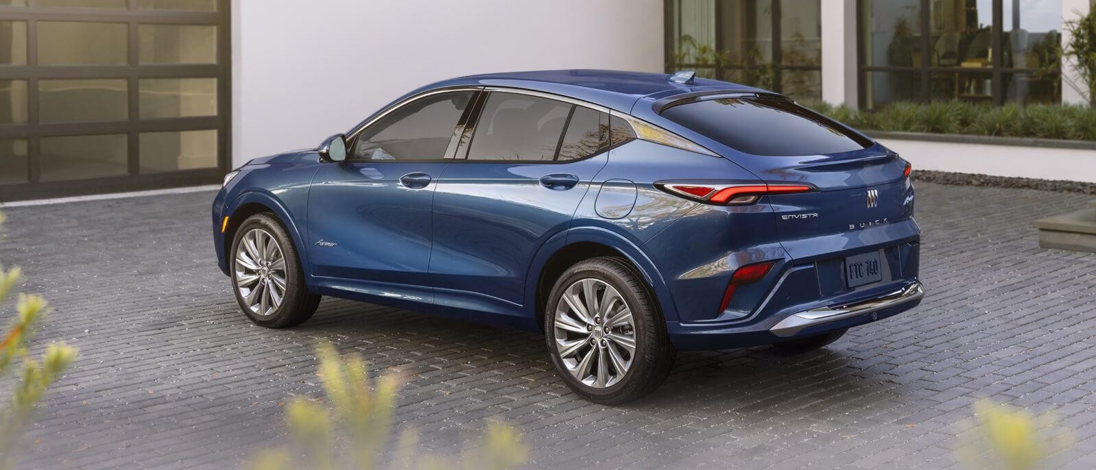 A 2024 Buick Envista parked in front of garage