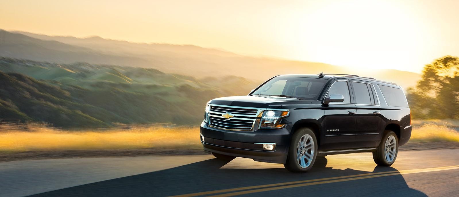 Chevrolet Suburban on hillside road