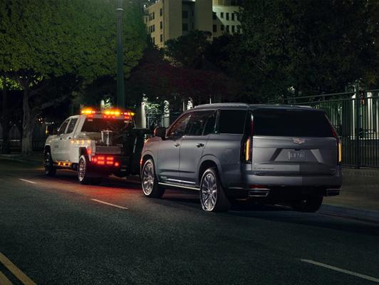 Cadilac getting towed at night time Cadilac getting towed at night time