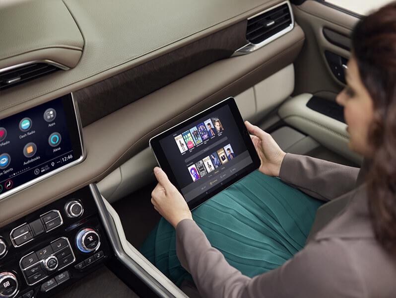 Woman inside a car with a tablet Woman inside a car with a tablet