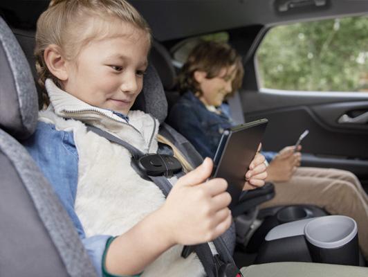 2 kids in the backseat of a buick on tablets 2 kids in the backseat of a buick on tablets