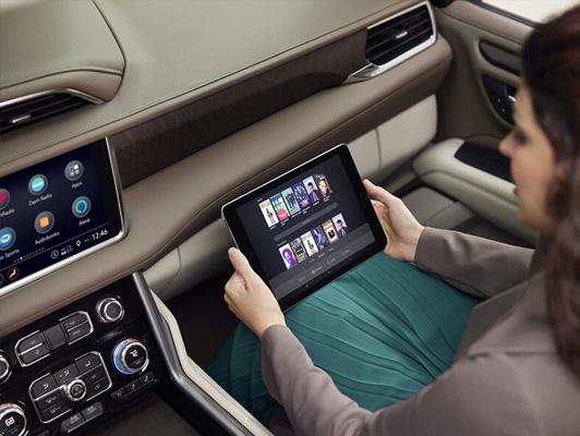 Woman inside a car with a tablet Woman inside a car with a tablet
