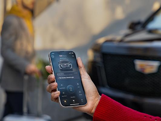 woman turning on car from phone woman turning on car from phone