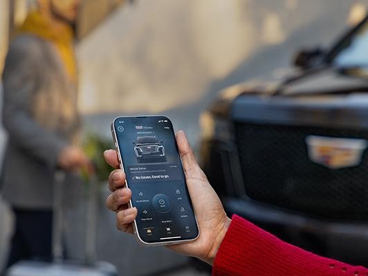 woman turning on car from phone