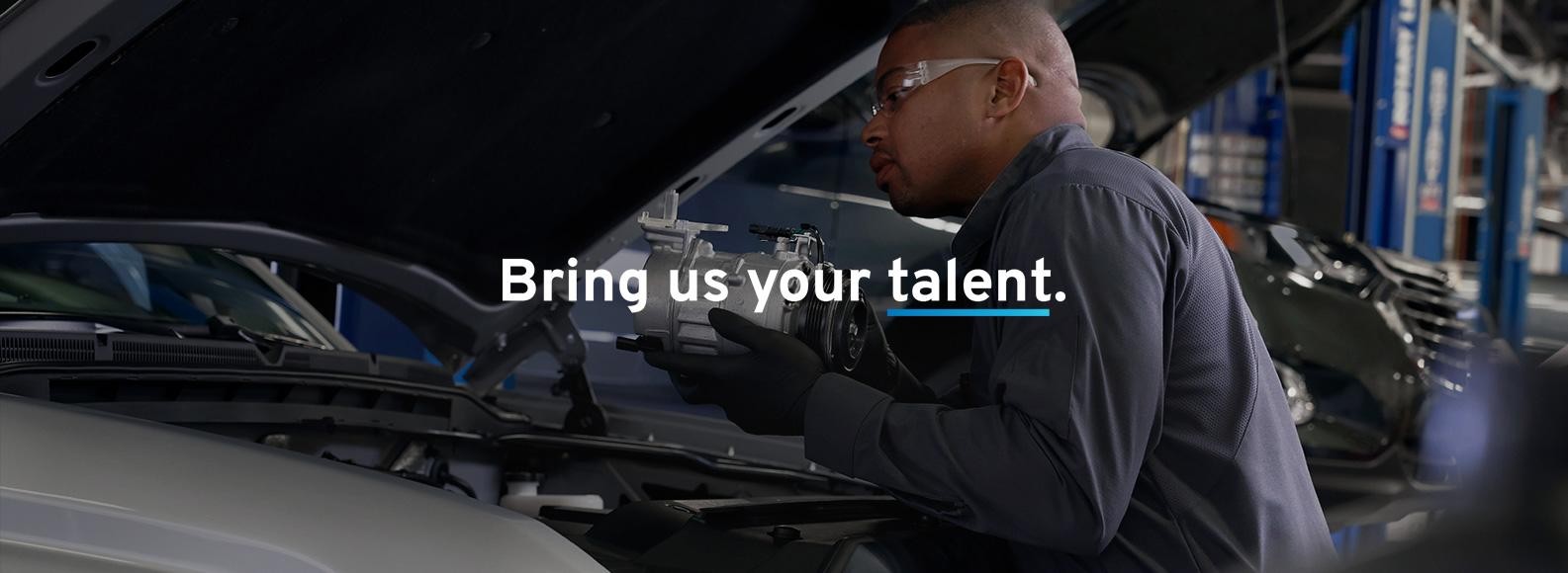 Service technician repairing the car