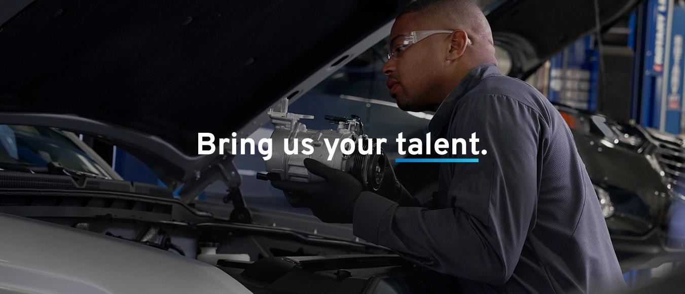 Service technician repairing the car