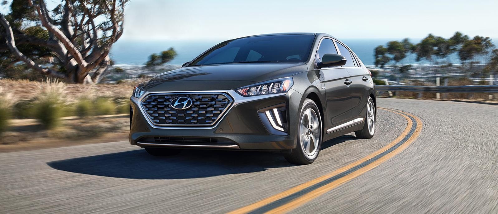 A grey 2022 Hyundai Ioniq Plug-In Hybrid running on the road.