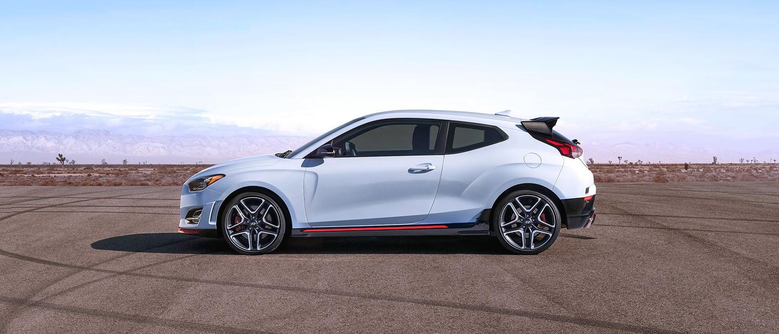 2022 white Hyundai Veloster N is parked at roadside.