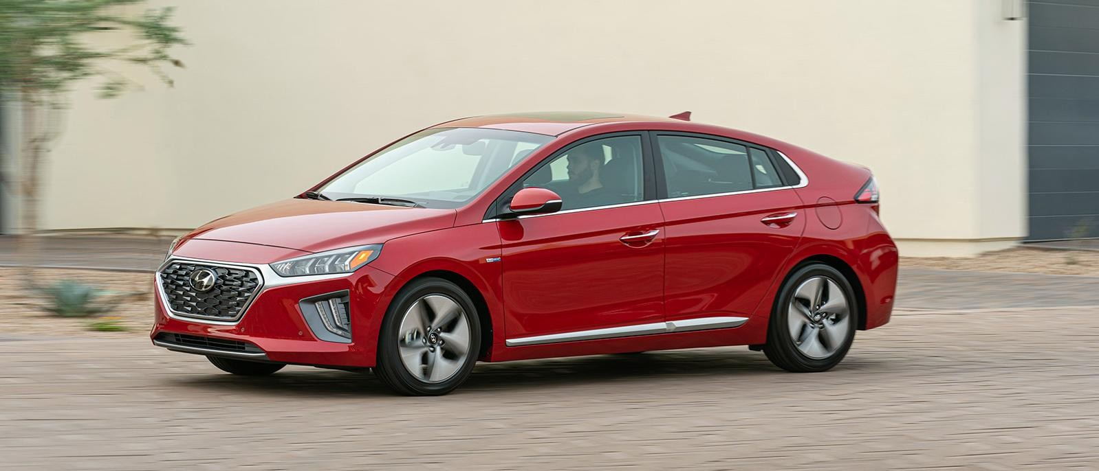 A red 2022 Hyundai Ioniq Hybrid running on the road.