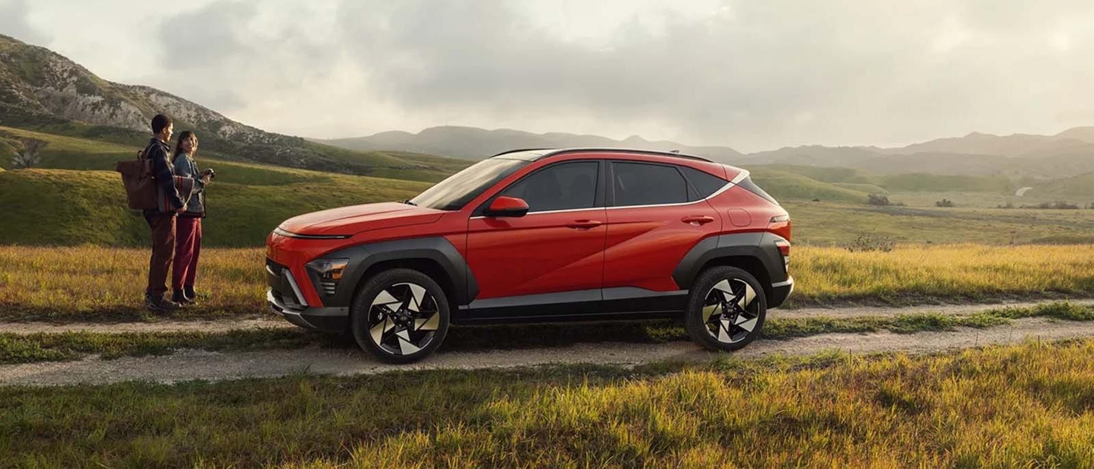 A red Hyundai Kona parked.