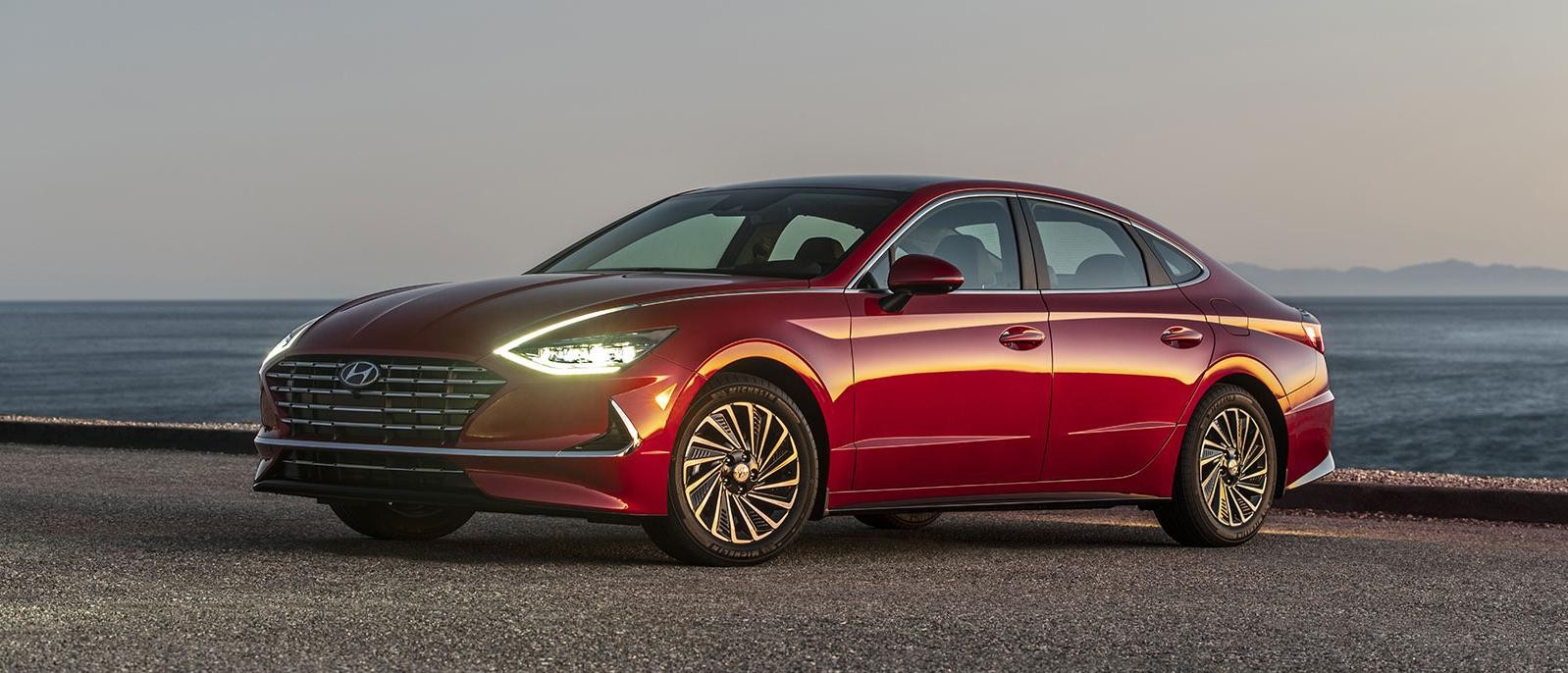 2022 red Hyundai Sonata Hybrid parked at beachside.