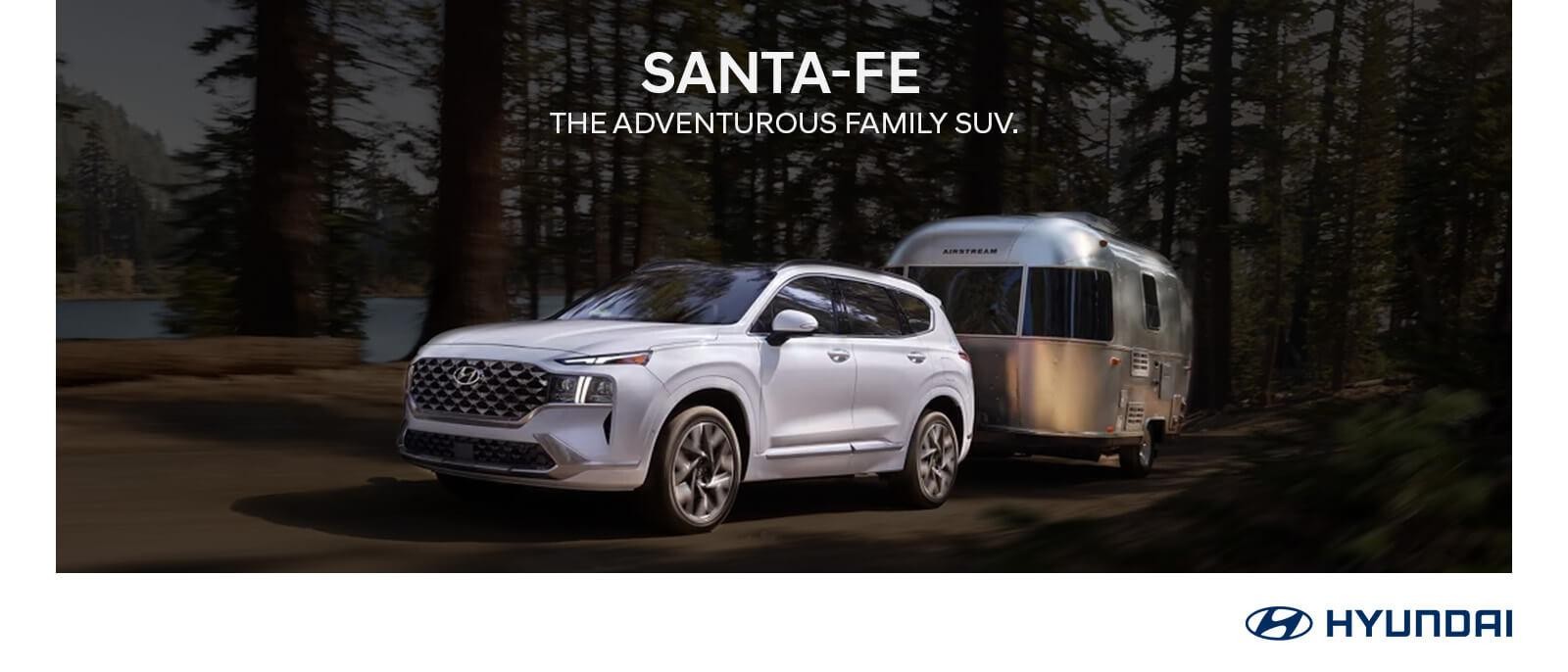 2023 Hyundai Santa Fe parked in forest.