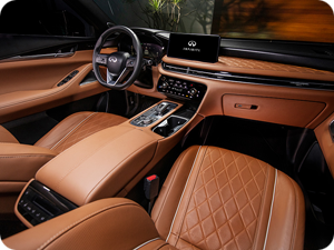 Interior view of an INFINITI QX60 in Saddle Brown leather.