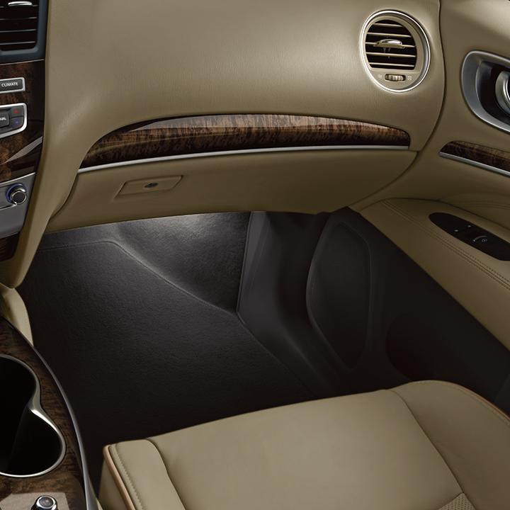 Interior view of an INFINITI QX60 front passenger area featuring wood trim. Interior view of an INFINITI QX60 front passenger area featuring wood trim.