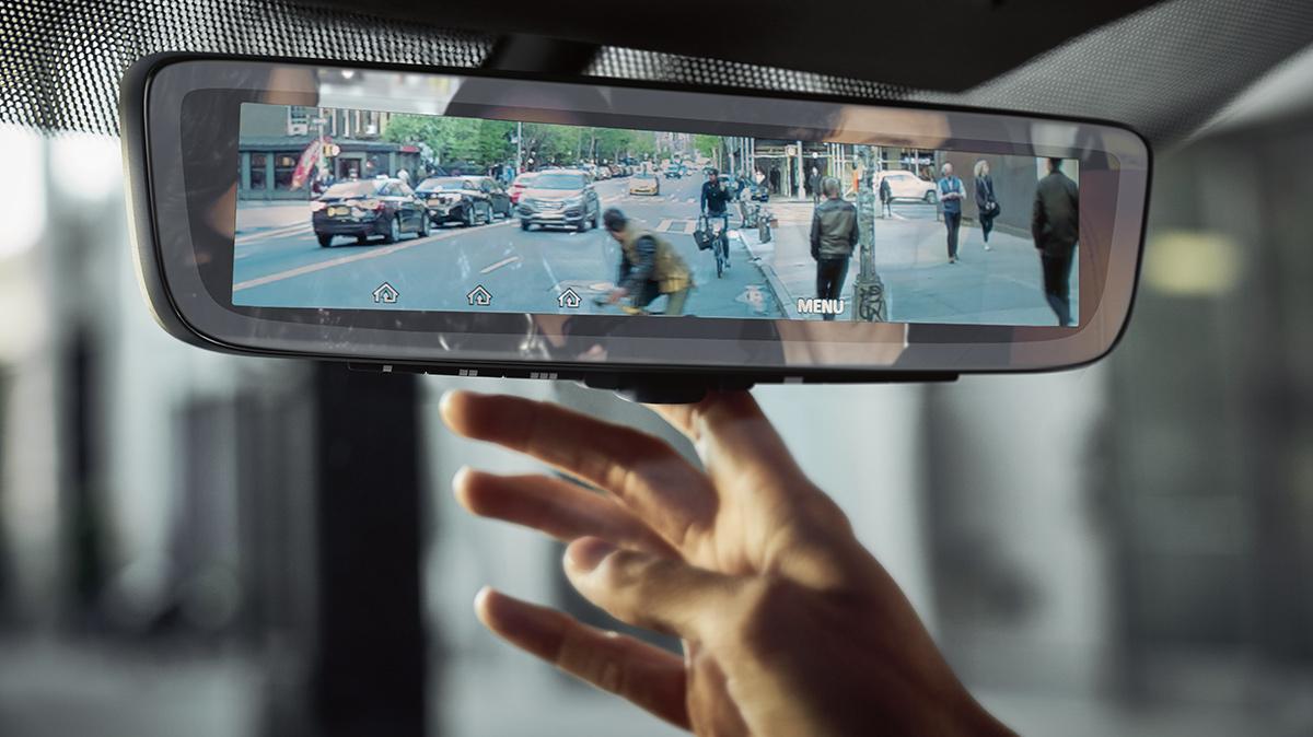 Interior detail of the video rear view mirror in an INFINITI QX80. Interior detail of the video rear view mirror in an INFINITI QX80.