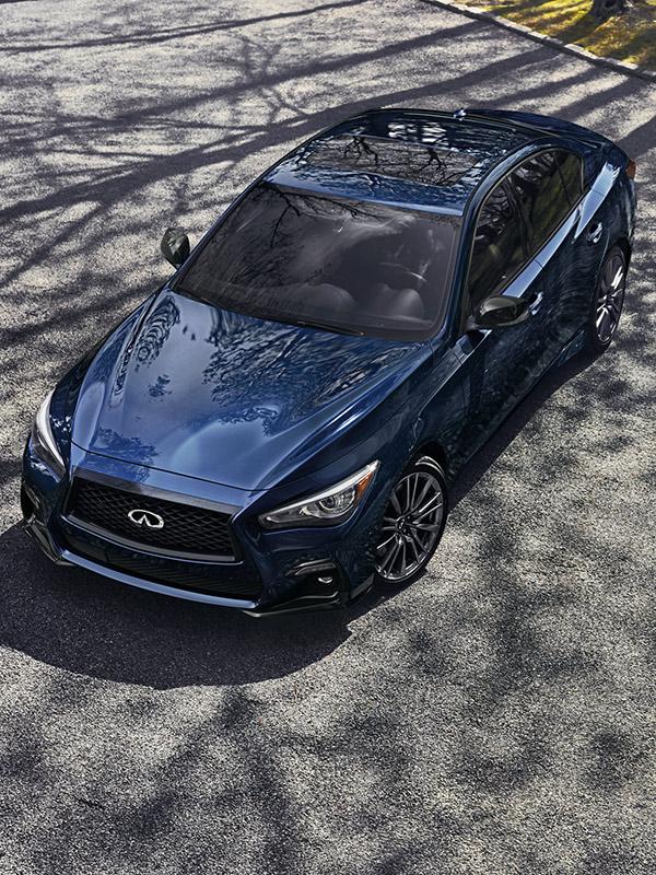 A high-angle view of a blue INFINITI Q50. A high-angle view of a blue INFINITI Q50.