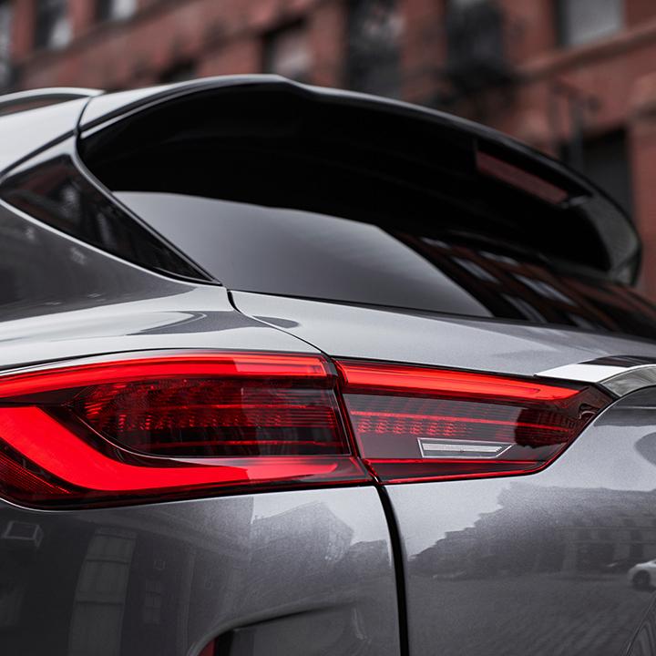 Close-up view of the taillight on a grey INFINITI QX50. Close-up view of the taillight on a grey INFINITI QX50.