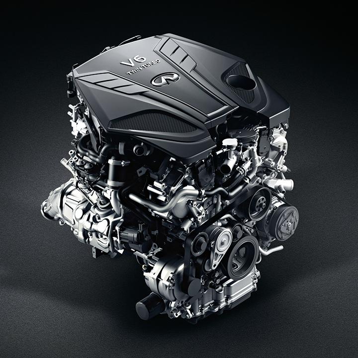 Studio view of an INFINITI Q60 engine on a grey background. Studio view of an INFINITI Q60 engine on a grey background.