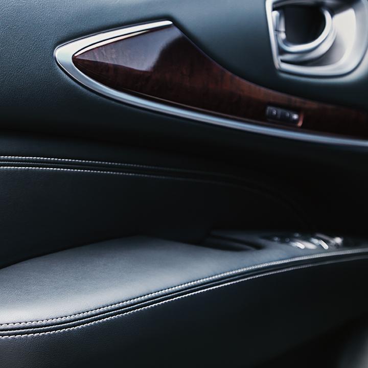 Close-up view of the interior door with wood trim on an INFINITI QX60. Close-up view of the interior door with wood trim on an INFINITI QX60.