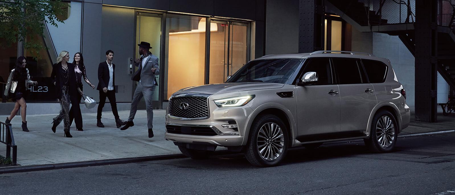 Gold 2021 Infiniti QX80 parked on the road. Gold 2021 Infiniti QX80 parked on the road.