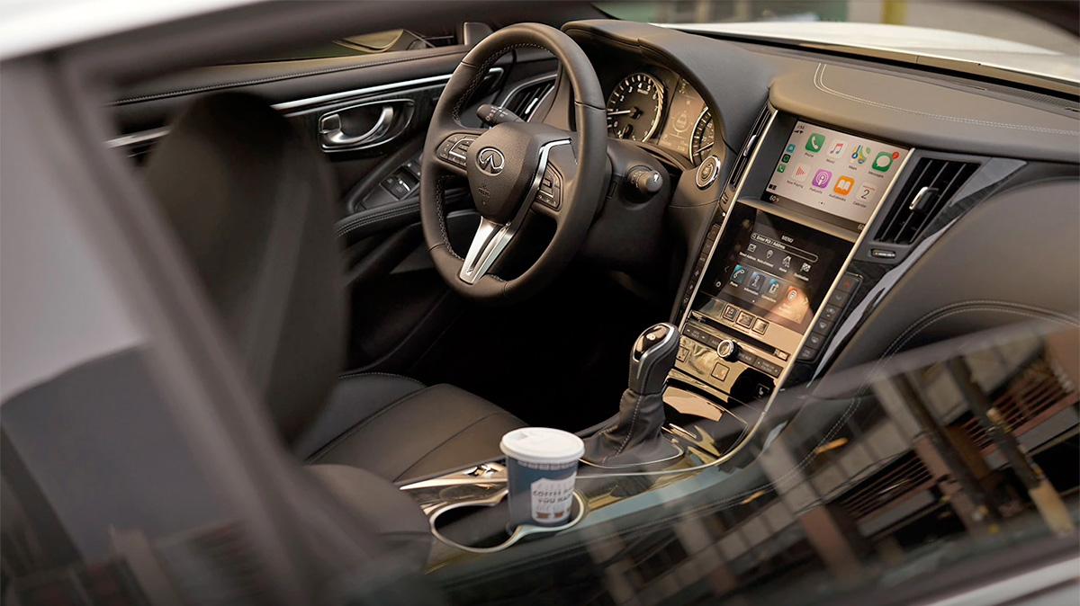 Interior view of an INFINITI Q60 with grey upholstery. Interior view of an INFINITI Q60 with grey upholstery.