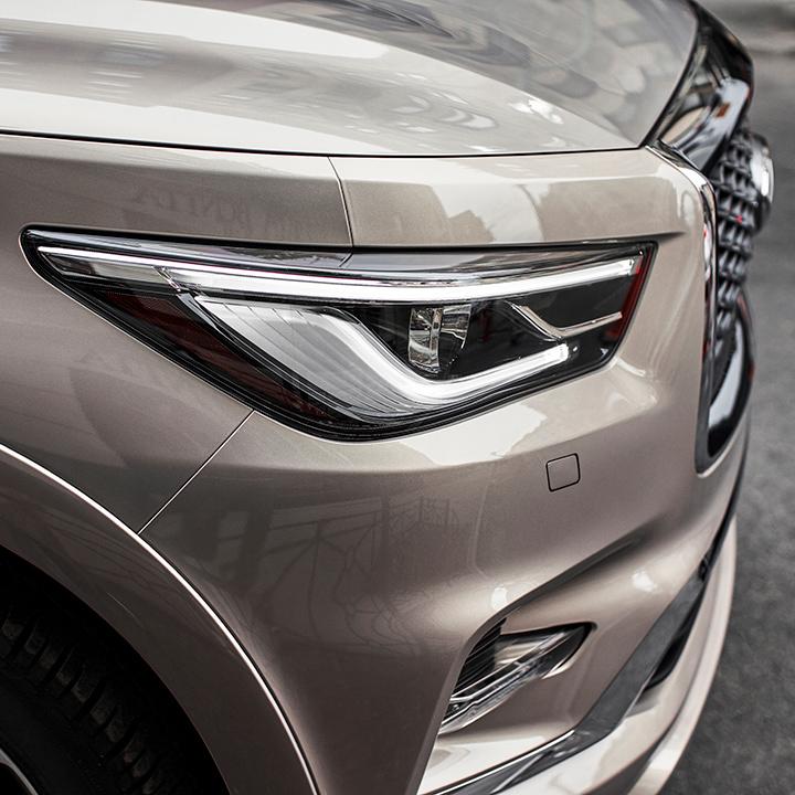 Close-up view of an INFINITI QX80 headlight. Close-up view of an INFINITI QX80 headlight.