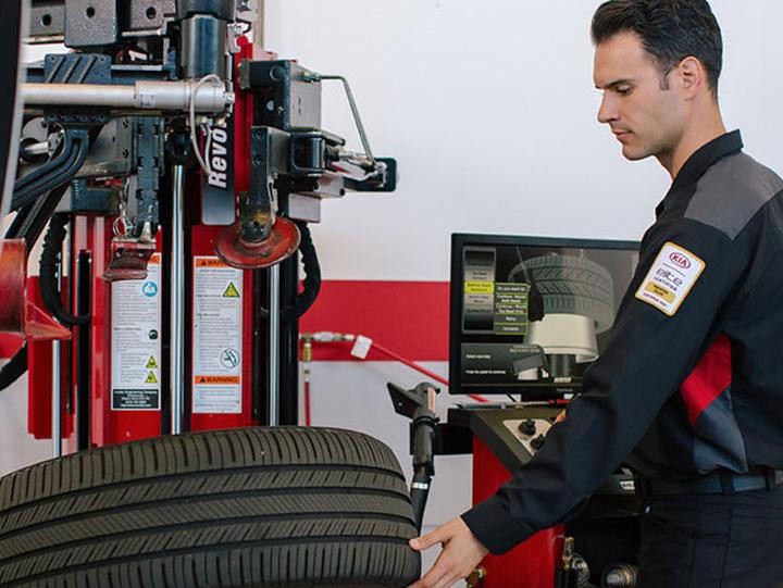 Technician checking on tires