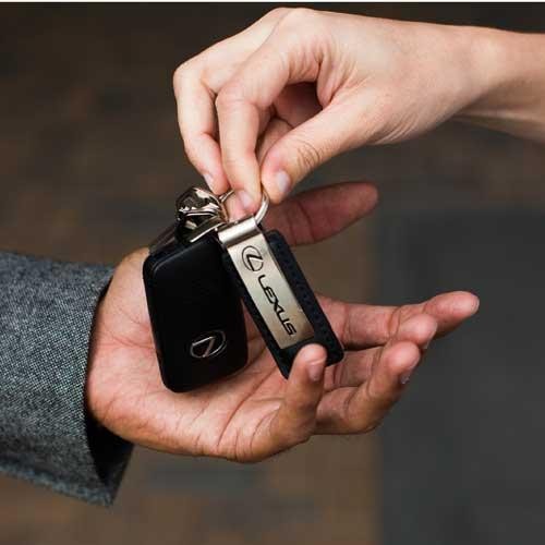 Lexus key FOB in a man's palm