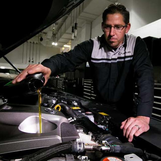 Man pouring oil