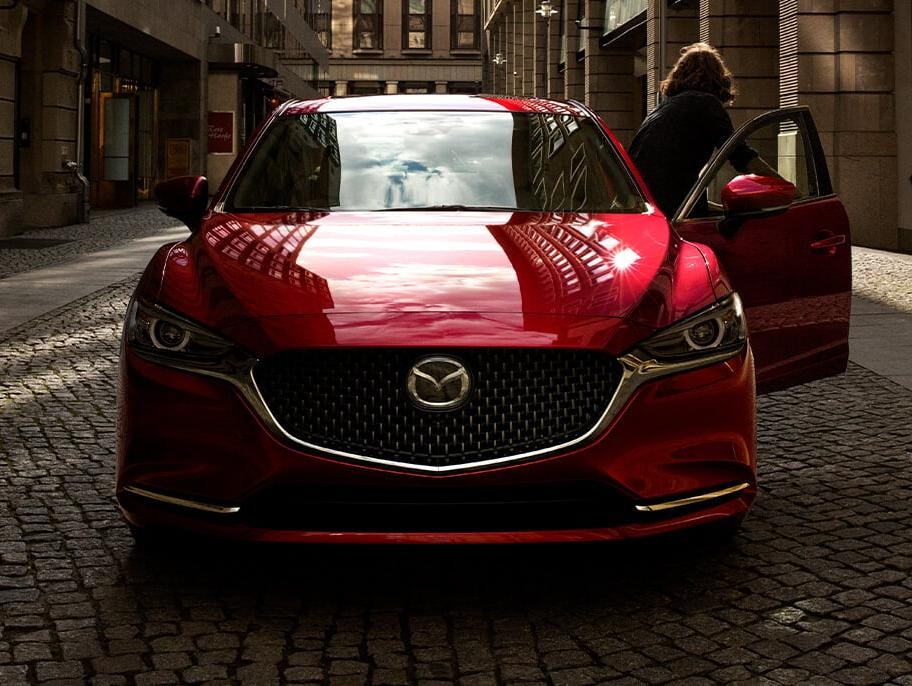 Man getting out of his 2019 Mazda6