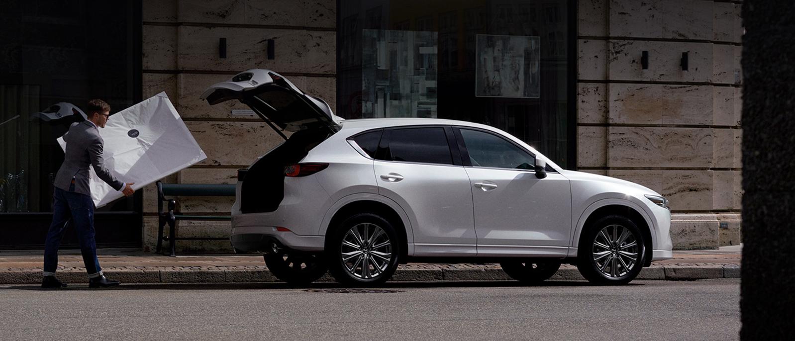 A 2022 Mazda CX-5 parked on the street. A 2022 Mazda CX-5 parked on the street.