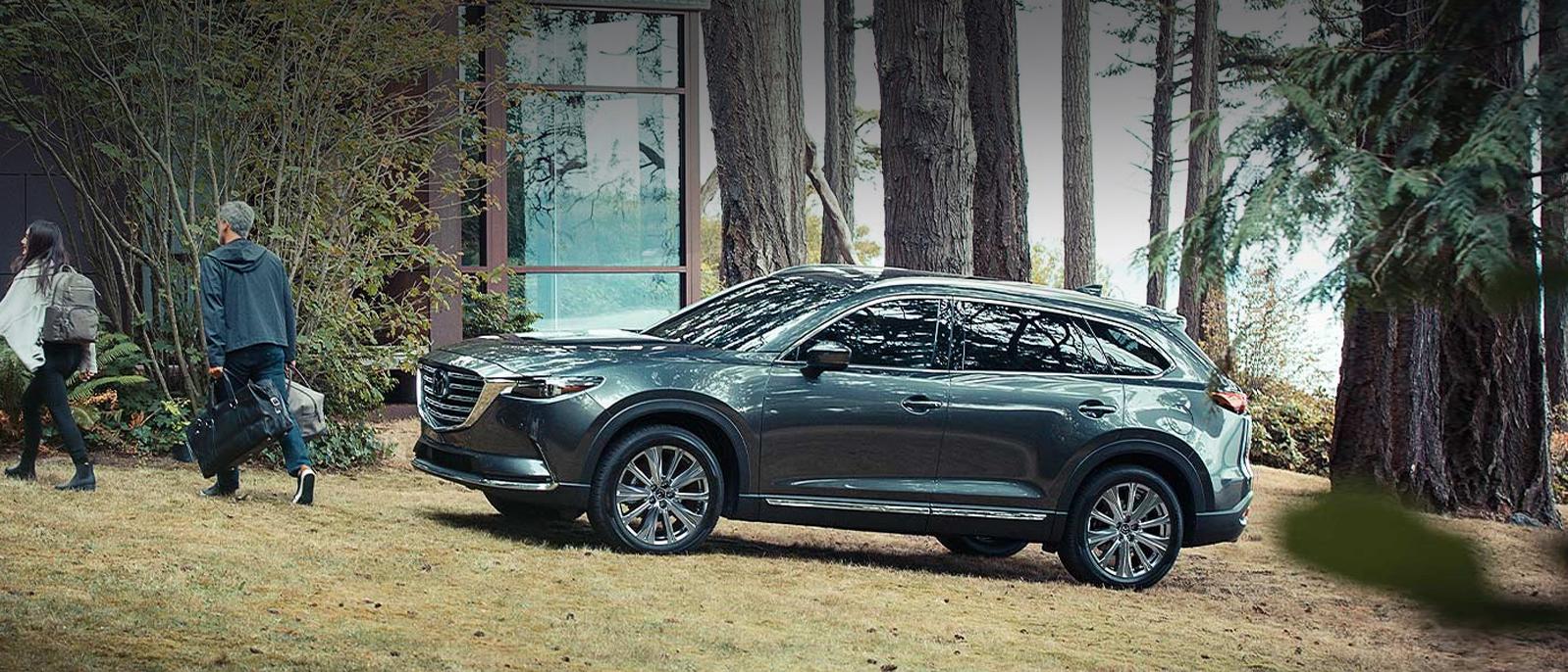 A 2022 Mazda CX-9 parked in the woods. A 2022 Mazda CX-9 parked in the woods.