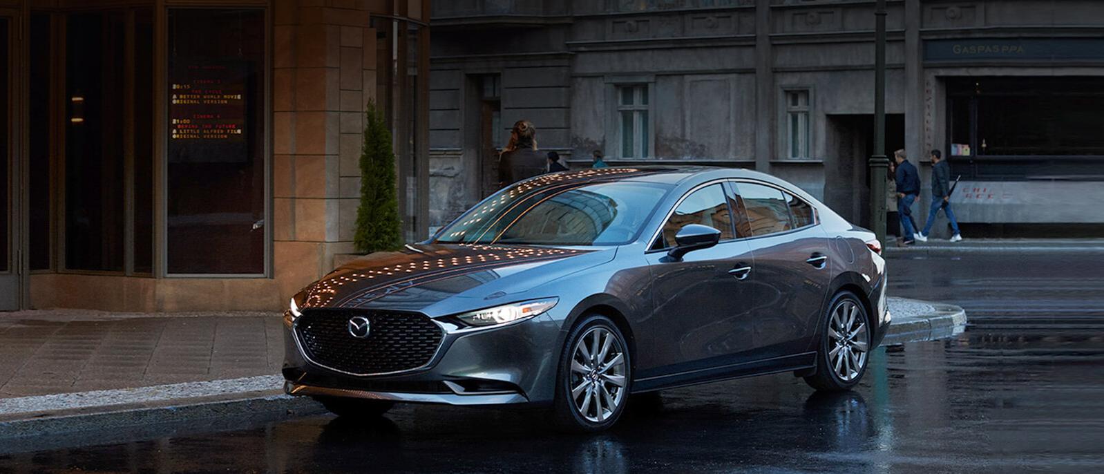 A 2021 Mazda3-Sedan on a city street. A 2021 Mazda3-Sedan on a city street.