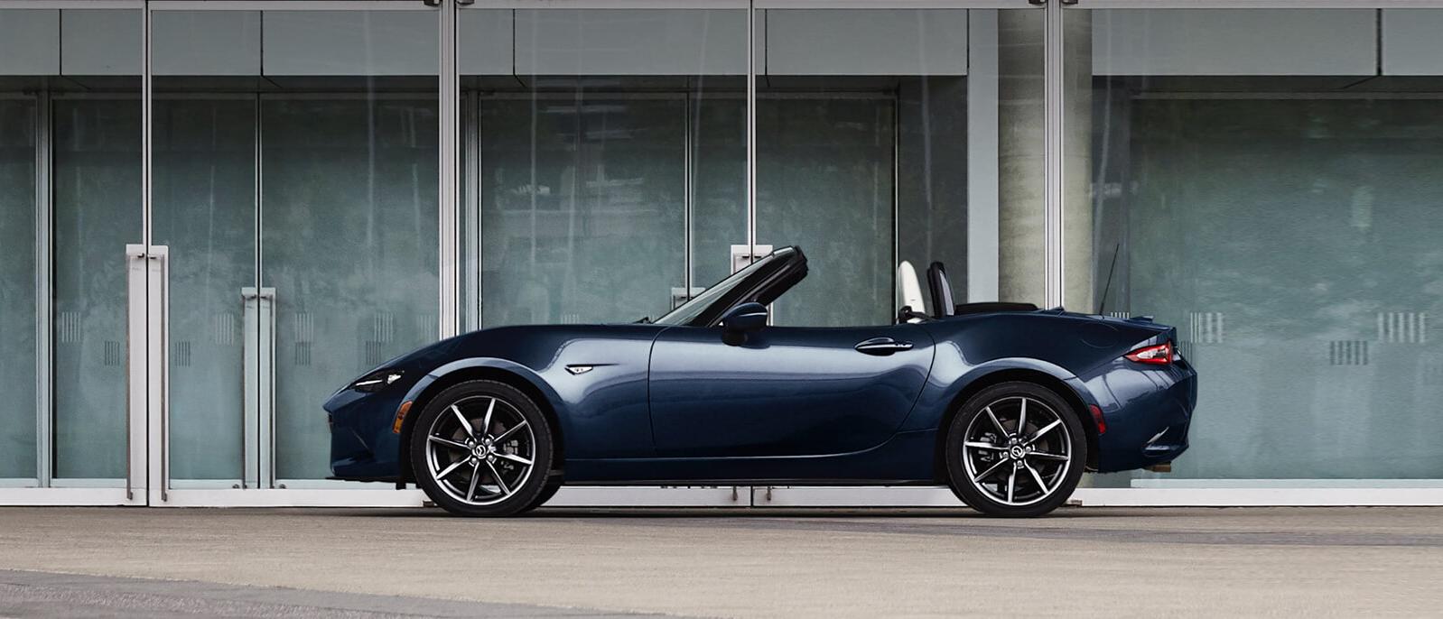 A 2021 MX-5 Miata in a parking space A 2021 MX-5 Miata in a parking space